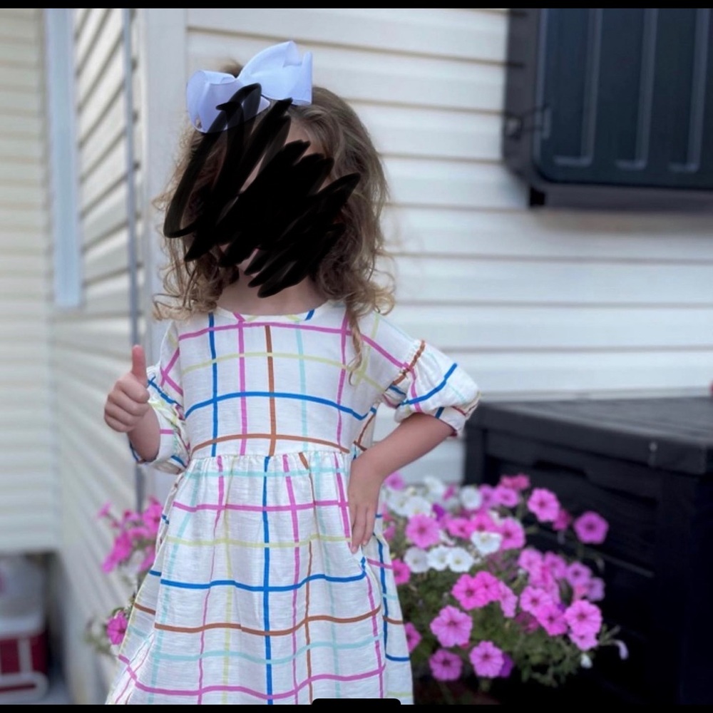 Girls puff sleeve dress with buttons on the back. Easter dress
